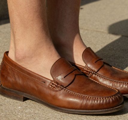 Man wearing penny loafers sockless in summer.