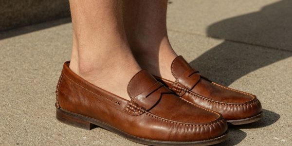 Man wearing penny loafers sockless in summer.