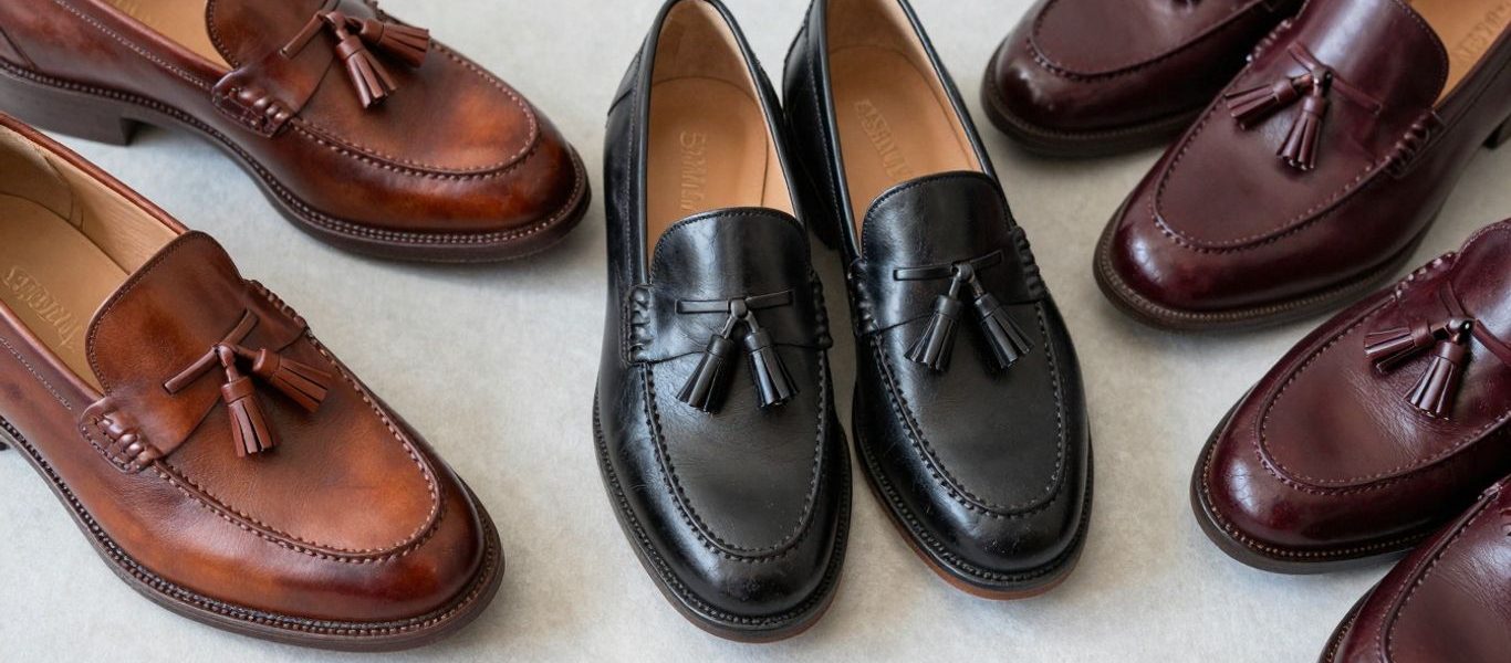 Stylish tassel loafers in various colors on a neutral background.