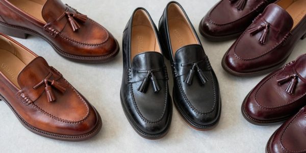 Stylish tassel loafers in various colors on a neutral background.