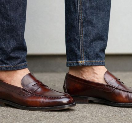 Man wearing penny loafers and jeans