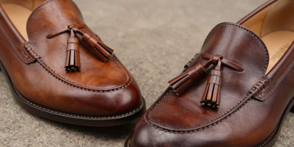 British and American tassel loafers side-by-side.