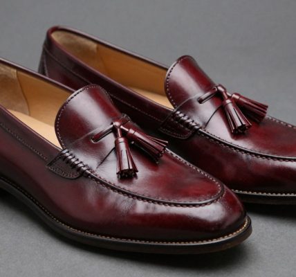 Burgundy tassel loafers with polished leather and decorative tassels.