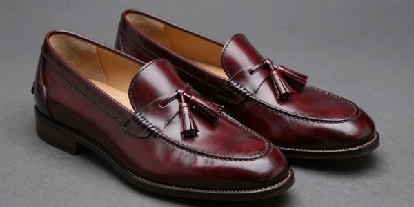 Burgundy tassel loafers with polished leather and decorative tassels.