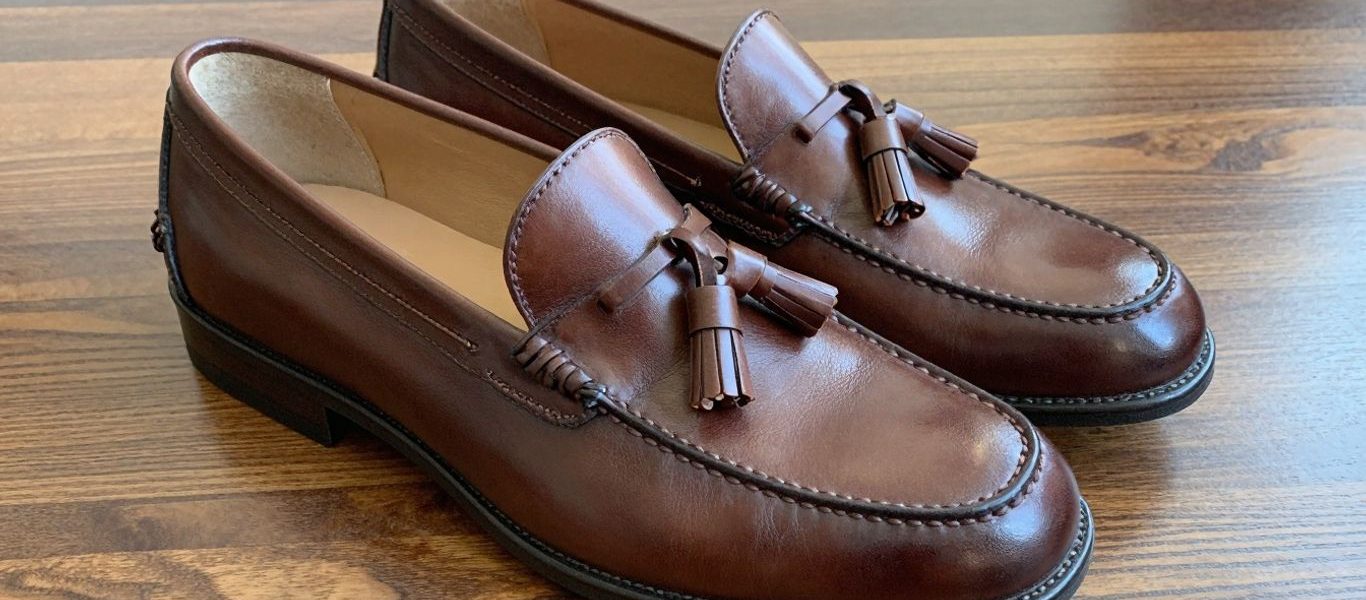 Alden tassel loafers in rich brown leather.