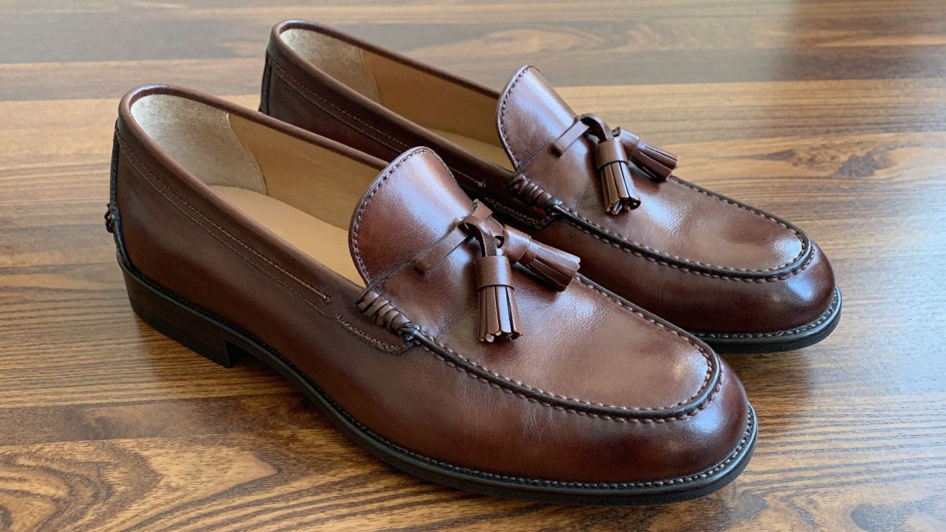 Alden tassel loafers in rich brown leather.